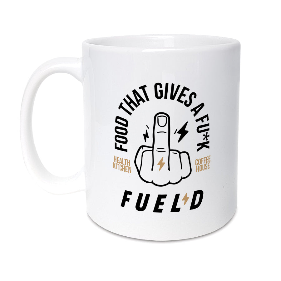 White FUEL’D ceramic mug with “Food That Gives a Fu*k” middle finger design and North Shields Health Kitchen & Coffee House branding.